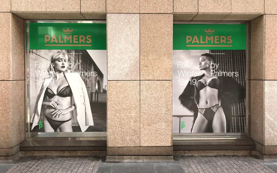 Schaufensterbeklebung - Zwei große Schaufenster mit vollfolierter Werbung für das Modehaus Palmers in Nünberg